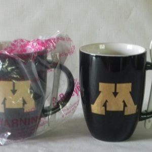 2 Black coffee mugs with spoons